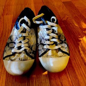 Navy and white Coach sneakers. Size is 9B. They are comfortable.